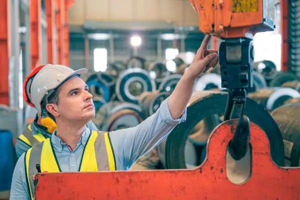 An industrial operator working with a jib crane.