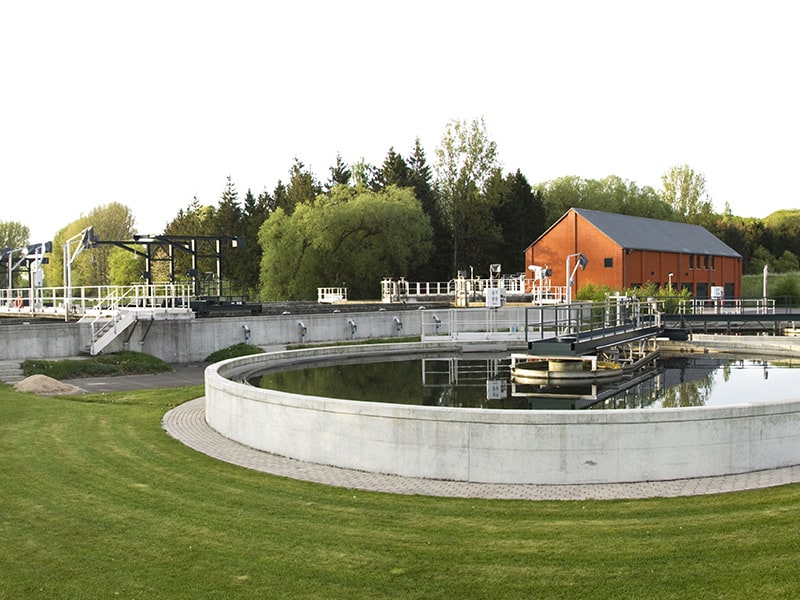 outside view of a water treatment plant with retention tanks