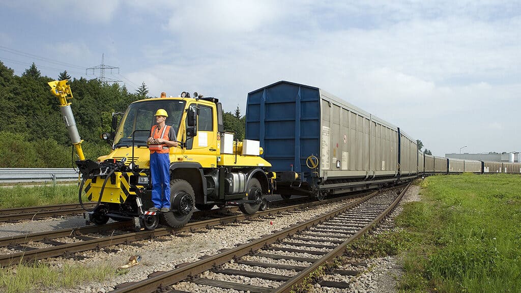 railyard worker using a locomotive remote control system for shunting