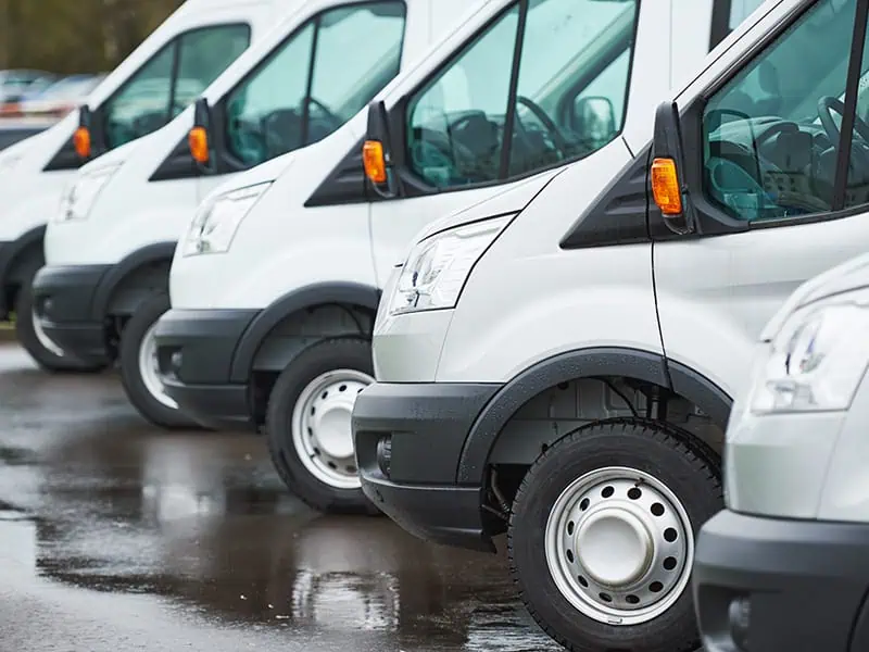 row of white service vans